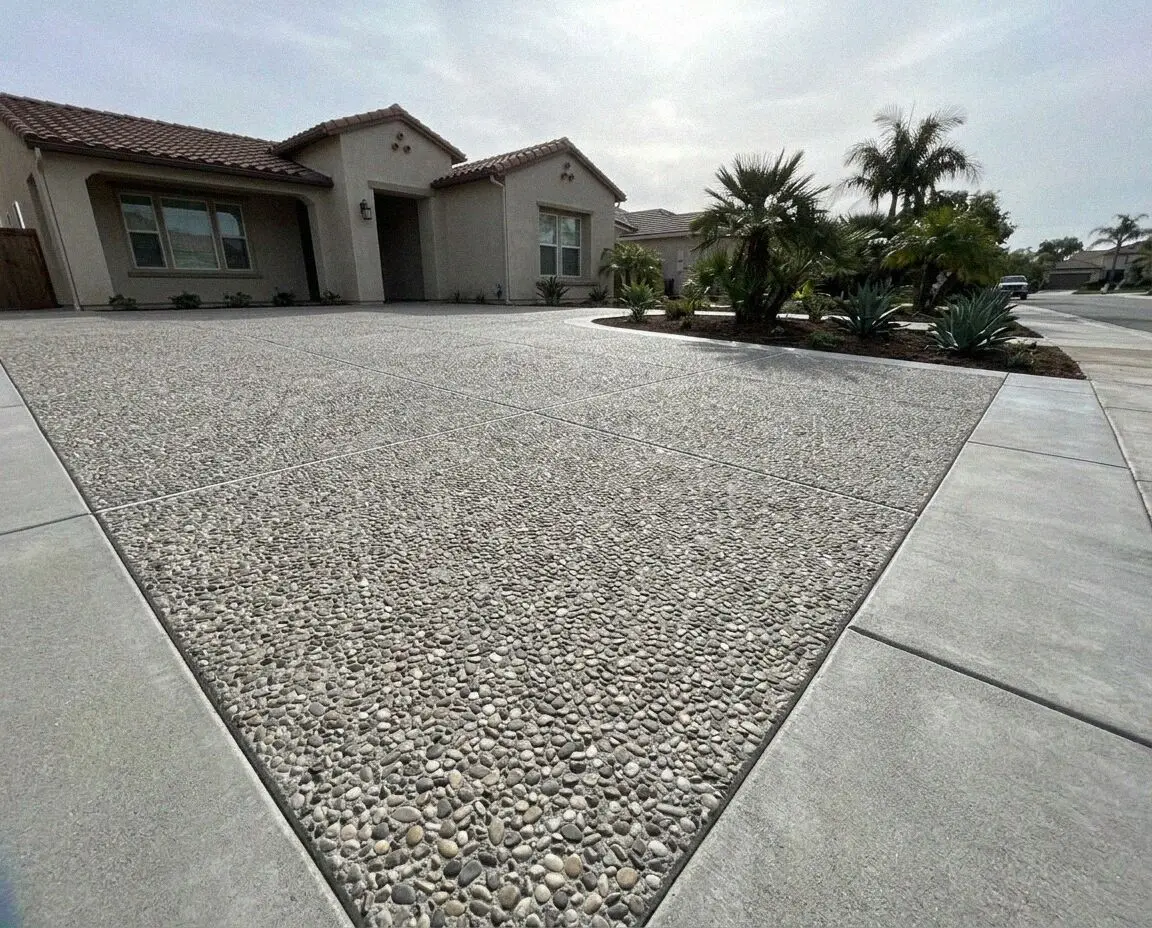 Exposed aggregate paving with a smooth border at a Huntington Beach home